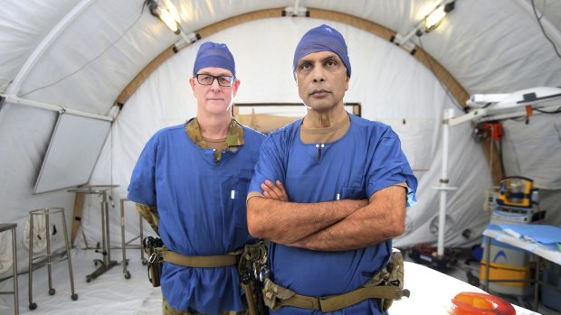 General surgeon and burns specialist Michael Rudd and orthopedic surgeon Major Jay Dave are both based at the medical facility at Camp Taji, Iraq.