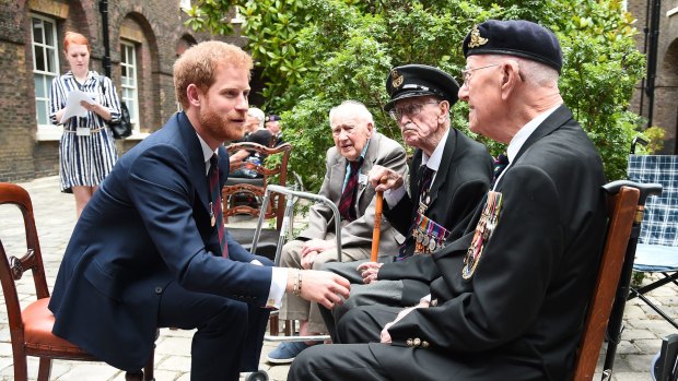 Prince Harry meets Dunkirk veterans Arthur Taylor and Garth Wright at a reception hosted by the Prince at Kensington Palace ahead of the world premiere of ''Dunkirk" on Thursday.