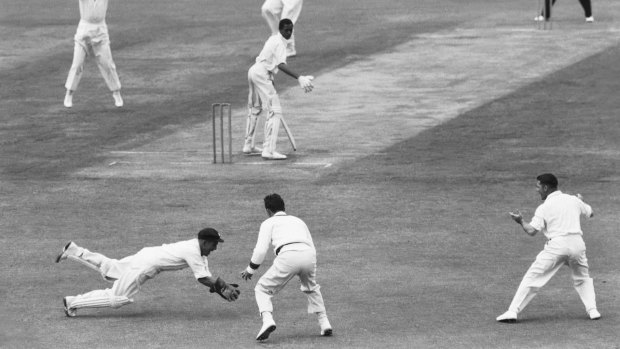 Tough competitor: Australian wicketkeeper Wally Grout takes a catch behind the stumps in the West Indian first innings of the Third Test at the Sydney Cricket Ground in January 1961.