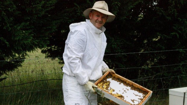 Niall Blair with his backyard beehive in the Southern Highlands. 