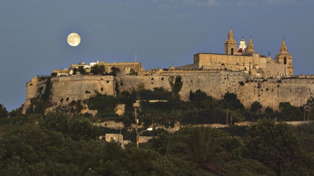 Moonlight over Mdina's fortified walls. 