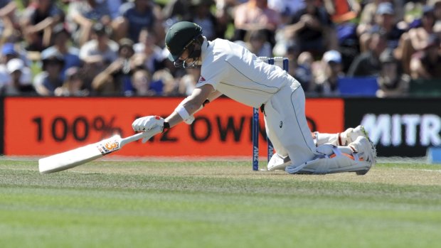 Nasty blow: Australia's Steve Smith falls forward after being hit on the helmet from a ball bowled by New Zealand's Neil Wagner.