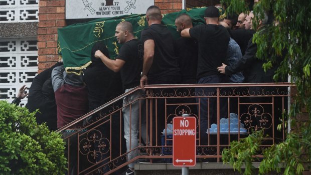Kemel Barakat's coffin is carried out of the Alawi Youth Movement Centre in March this year.