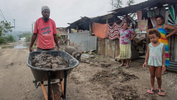 Vanuatu residents begin to clear up after Cyclone Pam roared through the Pacific nation.