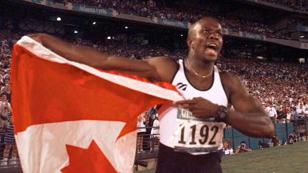 Canadian Donovan Bailey celebrates after winning the gold medal in the men's 100m final at the 1996 Summer Olympics in Atlanta.