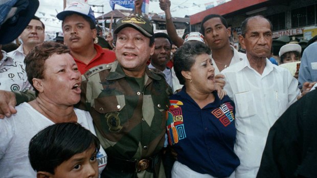 May 1989: Manuel Noriega with supporters in the Chorrilo neighbourhood  in Panama City. The dictator often presented himself as a champion of Panama's poor.