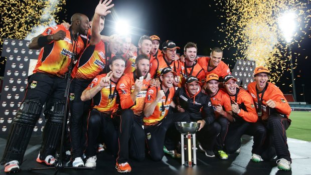 To the victors go the spoils: The Perth Scorchers celebrate their second straight Big Bash title.