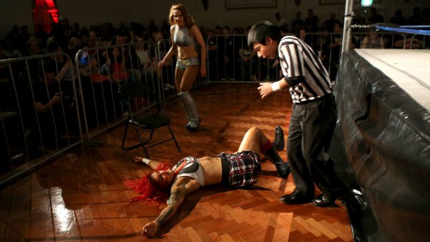Kellyanne (on ground) takes on Evie during a Melbourne City Wrestling bout on December 2, 2016.