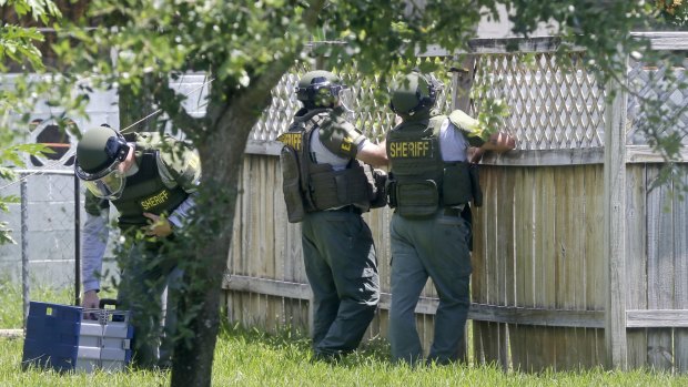 Bomb disposal officers check for bombs at an apartment complex possibly linked to the fatal shootings at the Orlando nightclub.