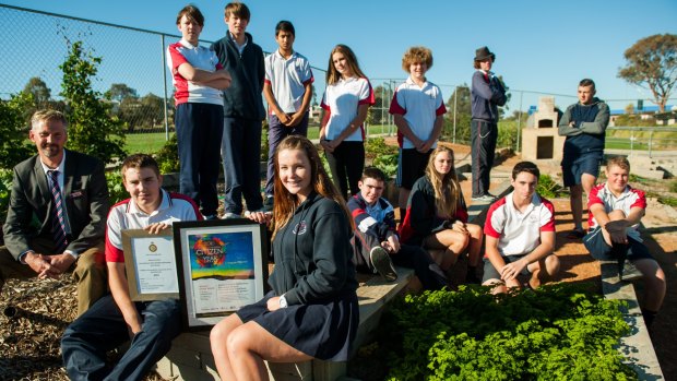 The Duke of Edinburgh award group at Amaroo School with their Young Canberra Citizen of the Year award. Students include Chris Preston and Megan Telford and Amaroo Duke of Edinburgh co-ordinator Jamie Foster.