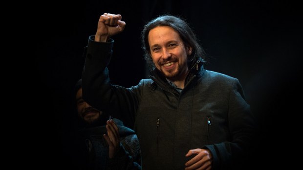 Podemos leader Pablo Iglesias acknowledges supporters.