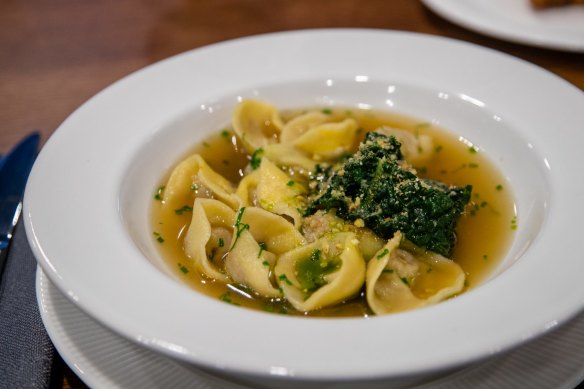 Duck and chestnut tortellini with braised greens and broth. 