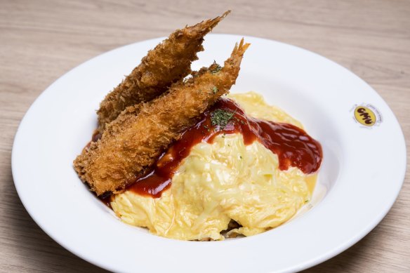 Omurice with tempura, tomato sauce and melted cheese.