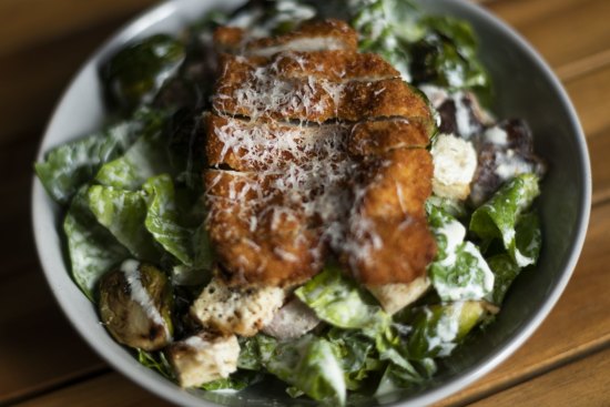 Charred brussels sprouts Caesar with optional schnitty.