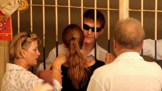 Stephen and Vicki Czugaj with daughter Mel Czugaj visiting their son Michael in
the Denpassar Gaol holding cell in 2006.