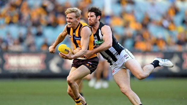 Tyson Goldsack puts the squeeze on Hawthorn's Liam Shiels.
