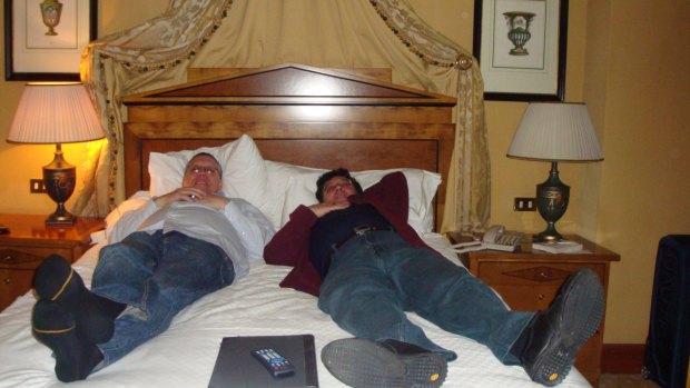 London holiday: Former Education Department officials Jeff Rosewarne (left) and Nino Napoli (right) on a hotel bed in London, evidence tendered at IBAC hearing on Tuesday.