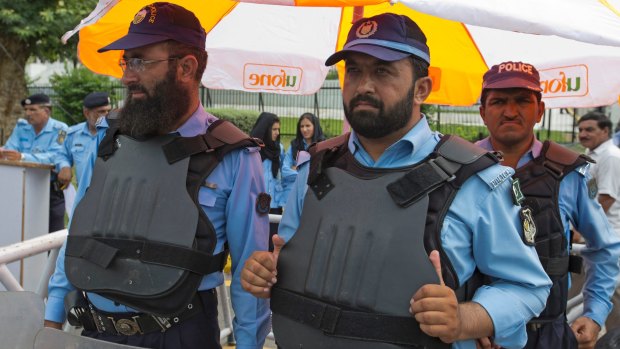 Security officers outside the Supreme Court building and Parliament in Islamabad on Friday.