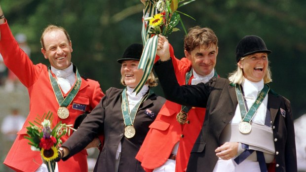 Australian equestrians (left to right) Andrew Hoy, Wendy Schaeffer, Phillip Dutton and Gillian Rolton jubilant in the wake of their gold medal win at the Atlanta Olympics.