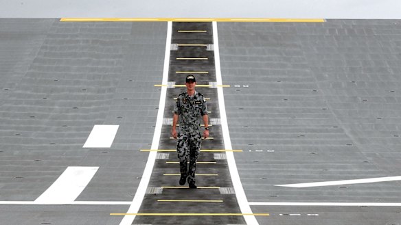 Able Seaman Robert Brook on the flight deck of HMAS Canberra.
