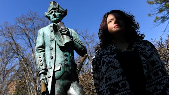 Genevieve Grieves next to the Captain James Cook statue at Cook's Cottage in Fitzroy Gardens.