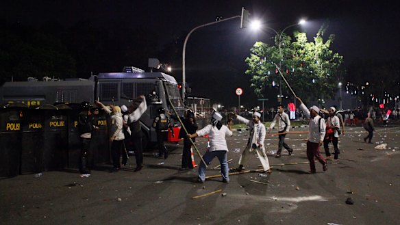 Clashes with police at a rally protesting against Ahok in Jakarta earlier this month.