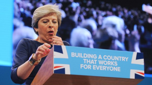British Prime Minister Theresa May struggled with a cough during her speech.