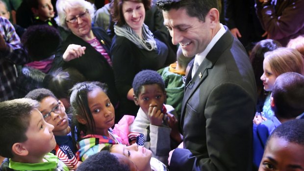 Fourth-grade children from Jerstad-Agerholm Elementary School surround House Speaker Paul Ryan, of Wisconsin, in Racine, Wisconsin.