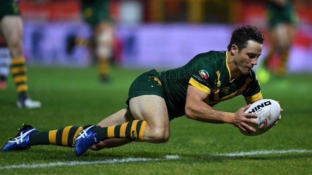 Back on board: Cooper Cronk scores against Scotland in Hull.