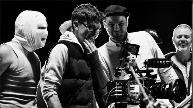 director Abe Forsythe (second from left) watches a take with actor Justin Rosniak, director of photography Lachlan Milne and stunt co-ordinator Tony Lynch.