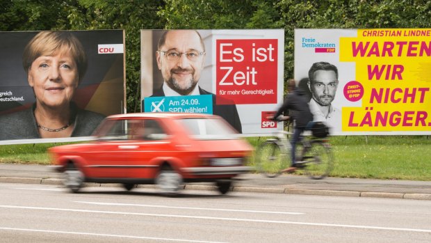 Election posters showing from left: CDU's German Chancellor Angela Merkel, social democrat challenger Martin Schulz and Free Democratic Party's Christian Lindner in Erfurt, central Germany on Friday.