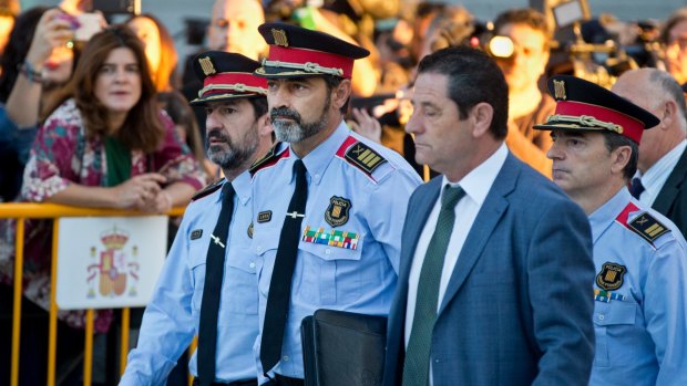 Catalan regional police chief Josep Luis Trapero, 2nd left, arrives at the national court in Madrid, Spain on Friday.