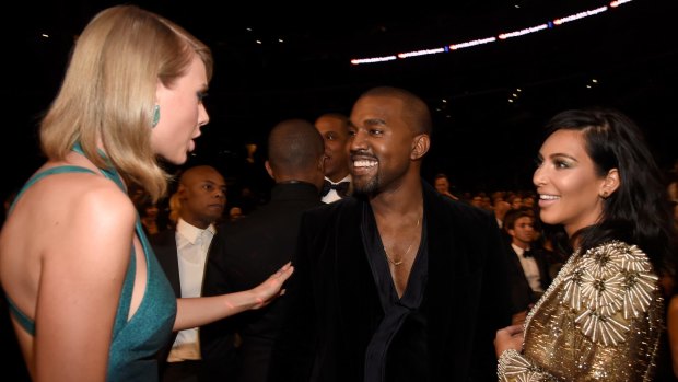 In happier times: Kim Kardashian West, husband Kanye West and Taylor Swift at the 2015 Grammy Awards.