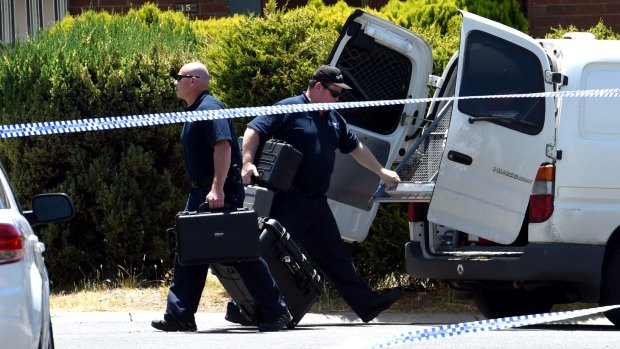 Australian Federal Police outside a home in Meadow Heights. 