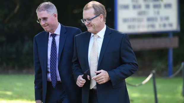 Scots College principal Ian Lambert, right, on his way to Wednesday's meeting. 