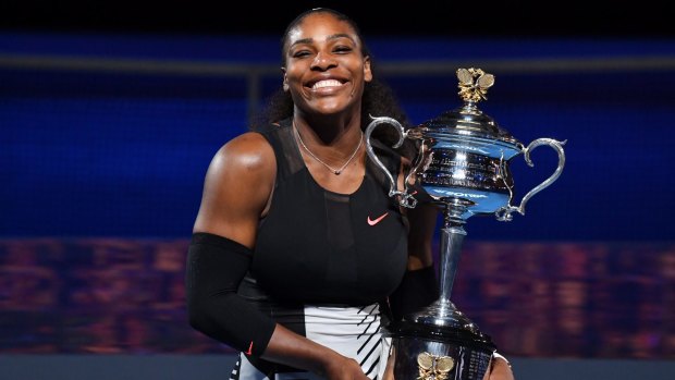 Serena Williams with the cup after beating sister Venus Williams.