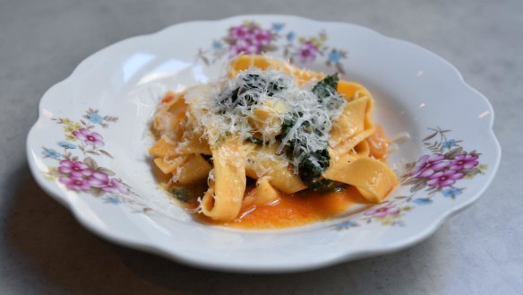 Fettuccine with wilted greens and chilli.