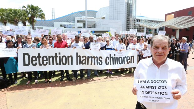 Doctors, nurses and other health care professionals protest the holding of children in detention.