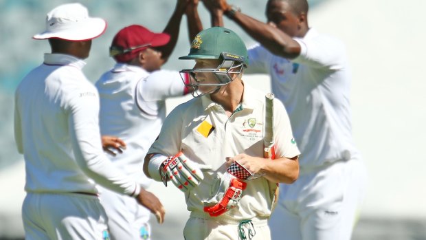 Fighting talk: David Warner had a few words with Carlos Brathwaite before he was dismissed by the West Indies bowler. The MCG has not been a happy hunting ground for Warner.
