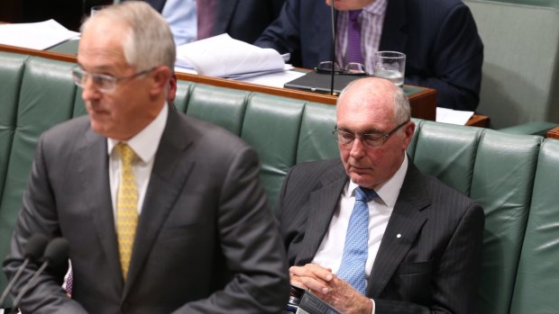 Deputy Prime Minister Warren Truss rests his eyes while Prime Minister Malcolm Turnbull is at the dispatch box during question time on Thursday.