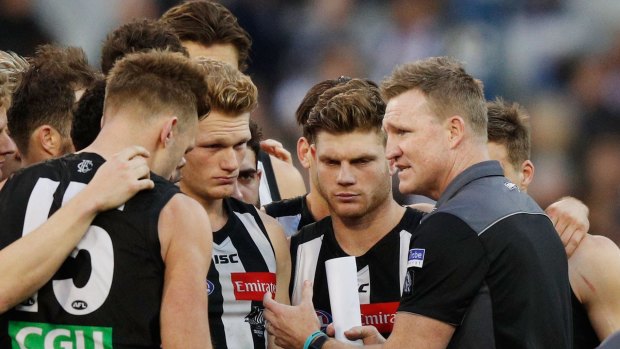 Fighting words: Nathan Buckley addresses Collingwood players at three quarter time.