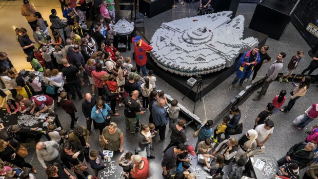 Families join forces at a LEGO event to build the Millennium Falcon to celebrate Star Wars Day at Westfield Southland.