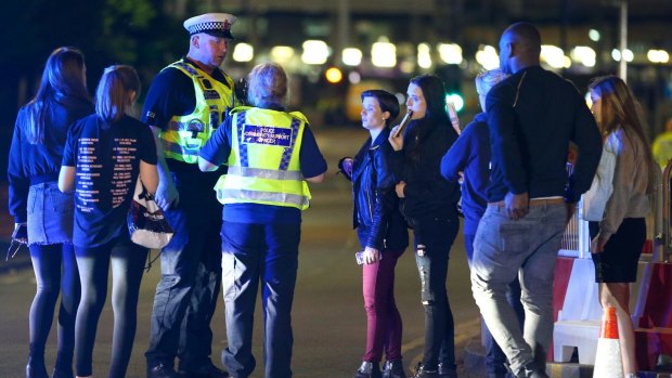 Police and fans close to the Manchester Arenaafter the blast.