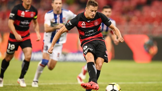 Calm finish: Oriol Riera of the Wanderers slots home a penalty from a controversial refereeing decision.