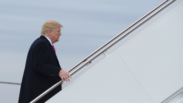 President Donald Trump walks up the steps of Air Force One heading to Florida to spend another weekend at Mar-a-Lago. 