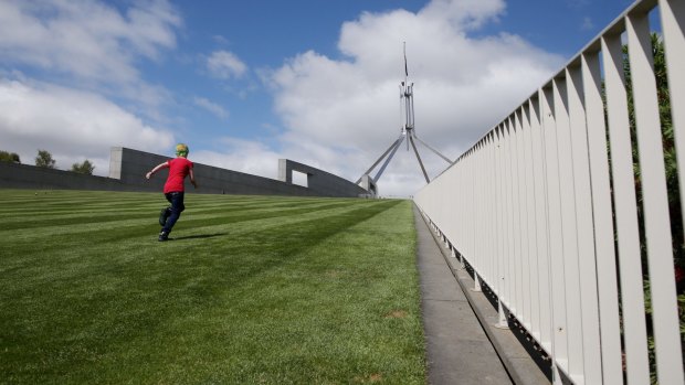 The new fence will cut across the lawns at the front of Parliament House.