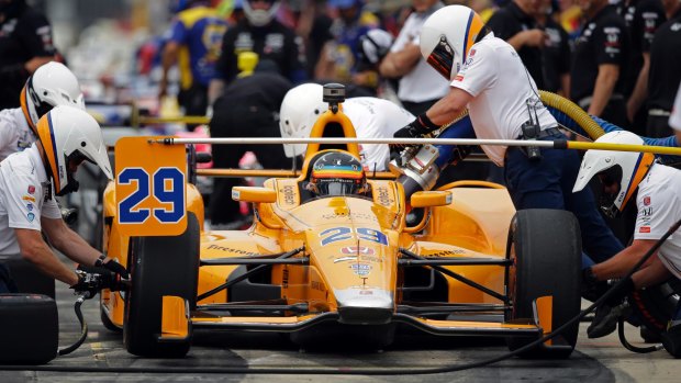 Fernando Alonso of Spain and his crew practice a pit stop during a practice session for the Indianapolis 500 IndyCar race.