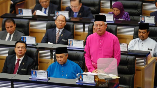 Malaysian Prime Minister Najib Razak (in pink) delivers Malaysia's 2017 budget to  parliament in Kuala Lumpur in October.