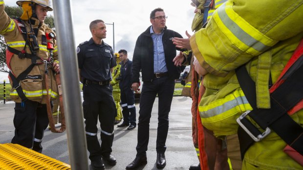 Under fire: Premier Daniel Andews meets CFA firefighters in Springvale earlier this month.