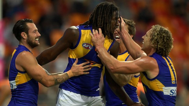 Nic Naitanui and the Eagles celebrate the ruckman's winning goal against GWS.